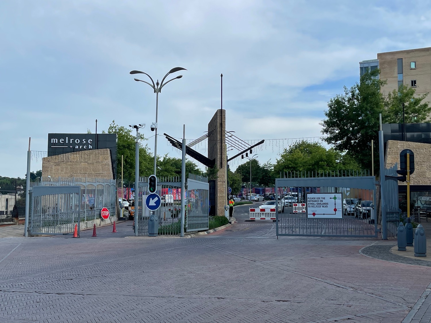 a gated area with cars and buildings