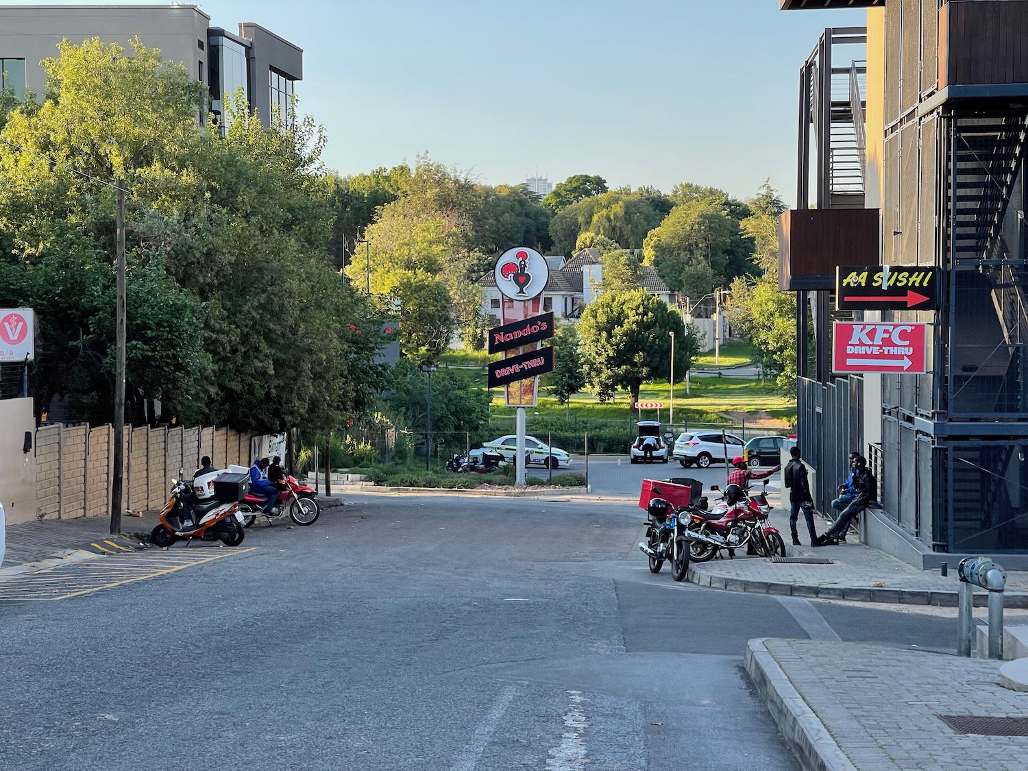 a street with motorcycles and people on it