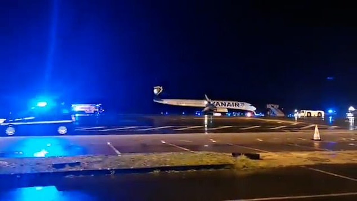 a plane on the runway at night