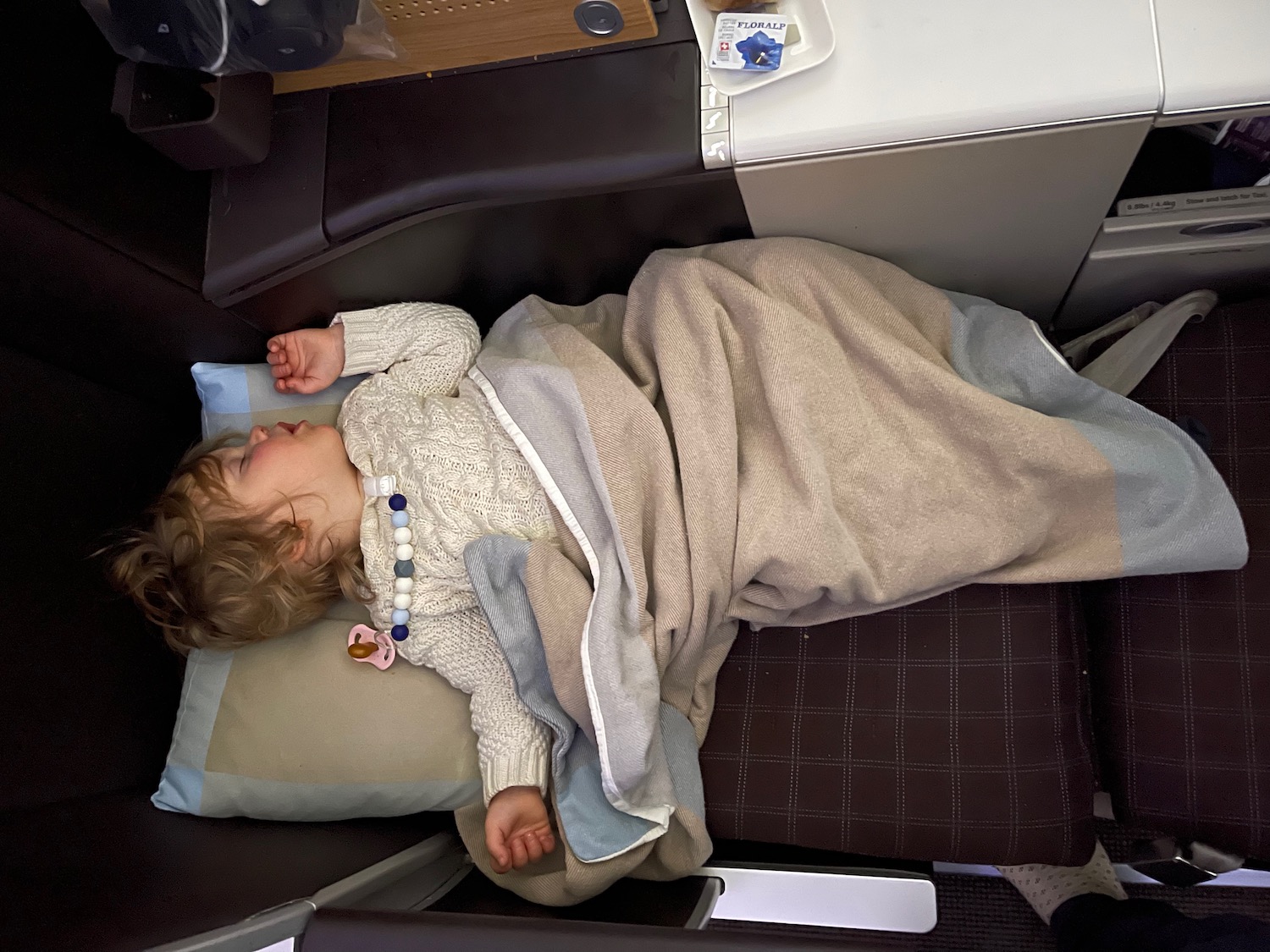 a child sleeping on a chair