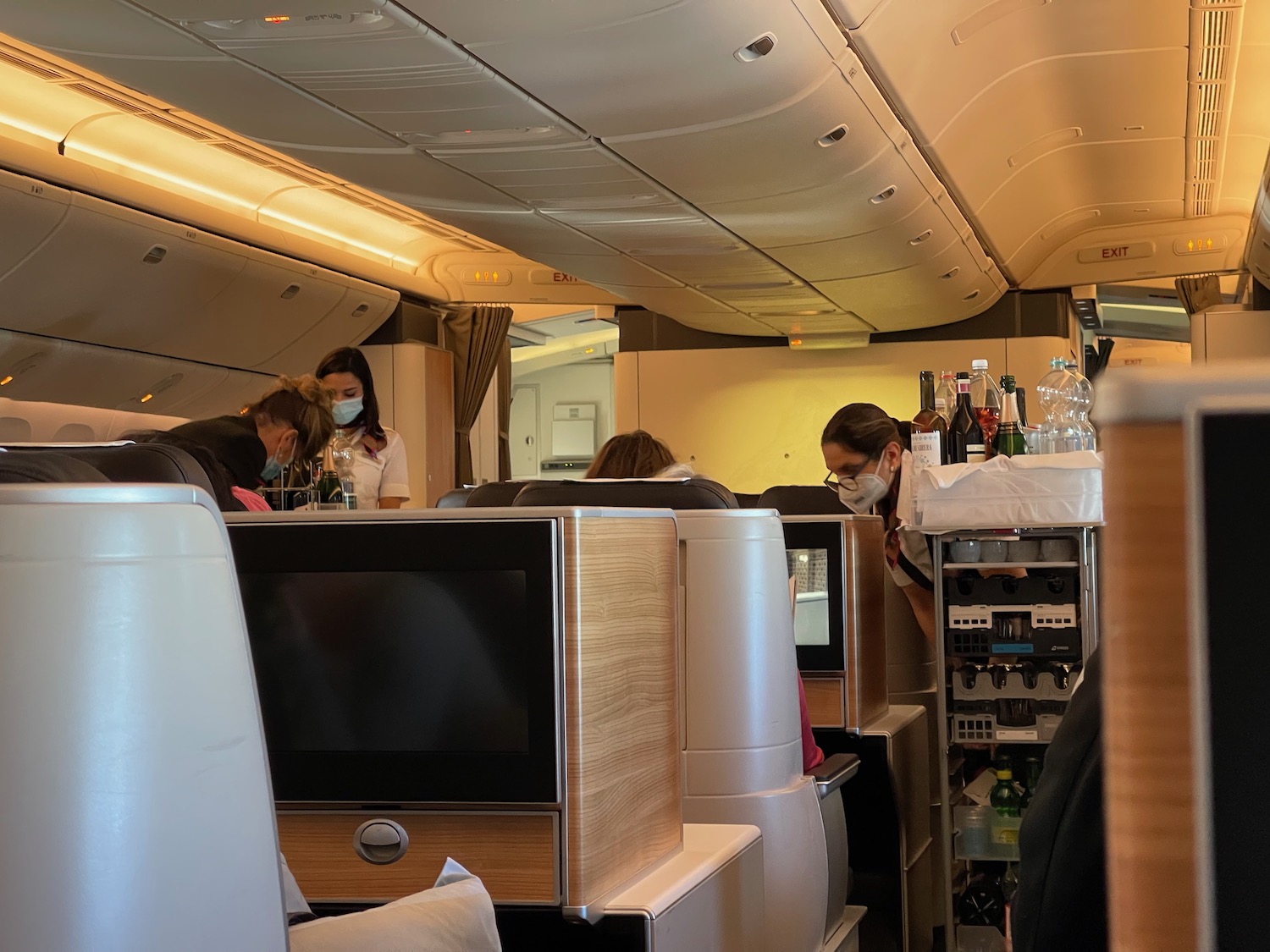 people in an airplane with a group of people in masks