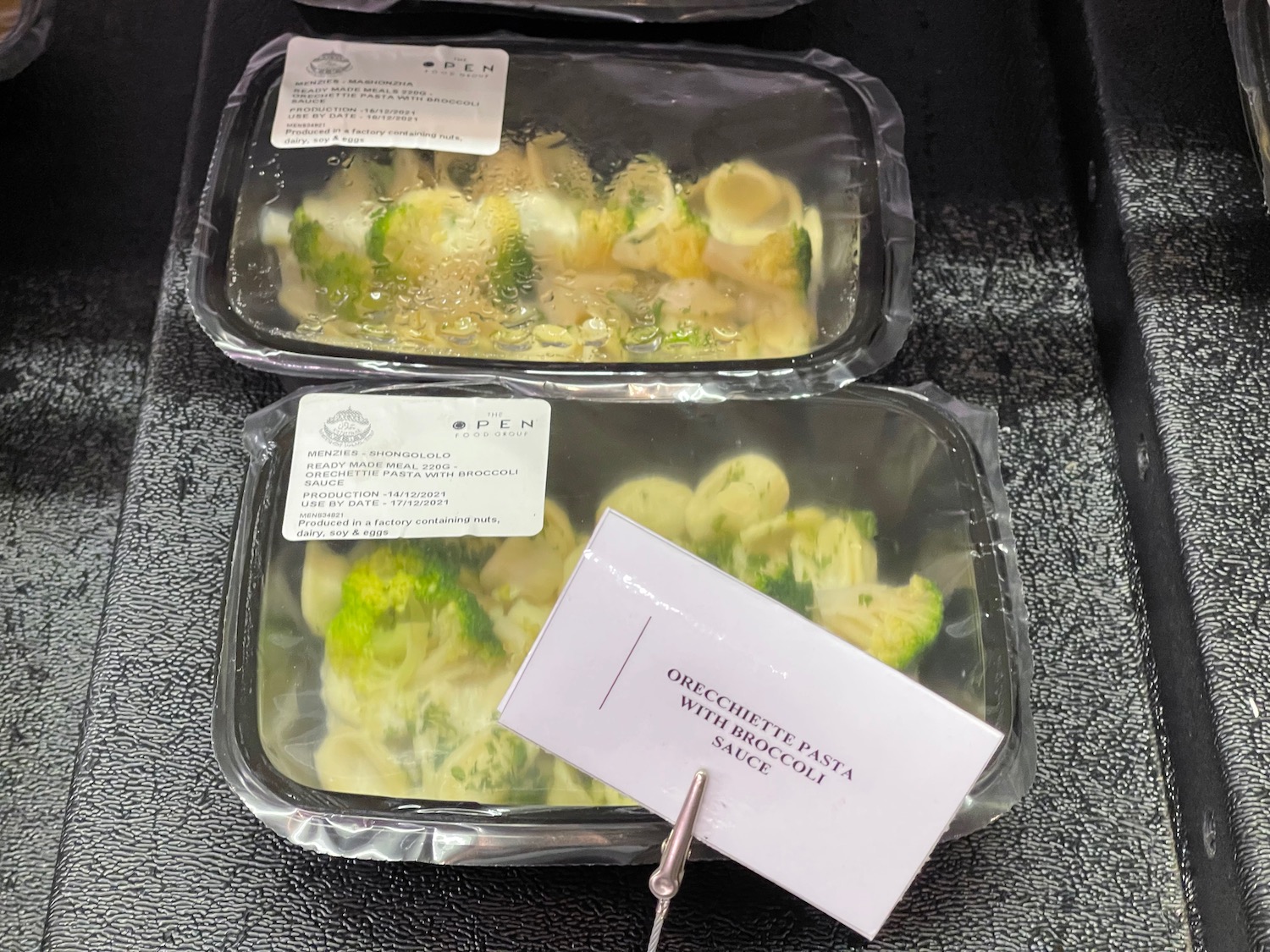 a trays of food with a label