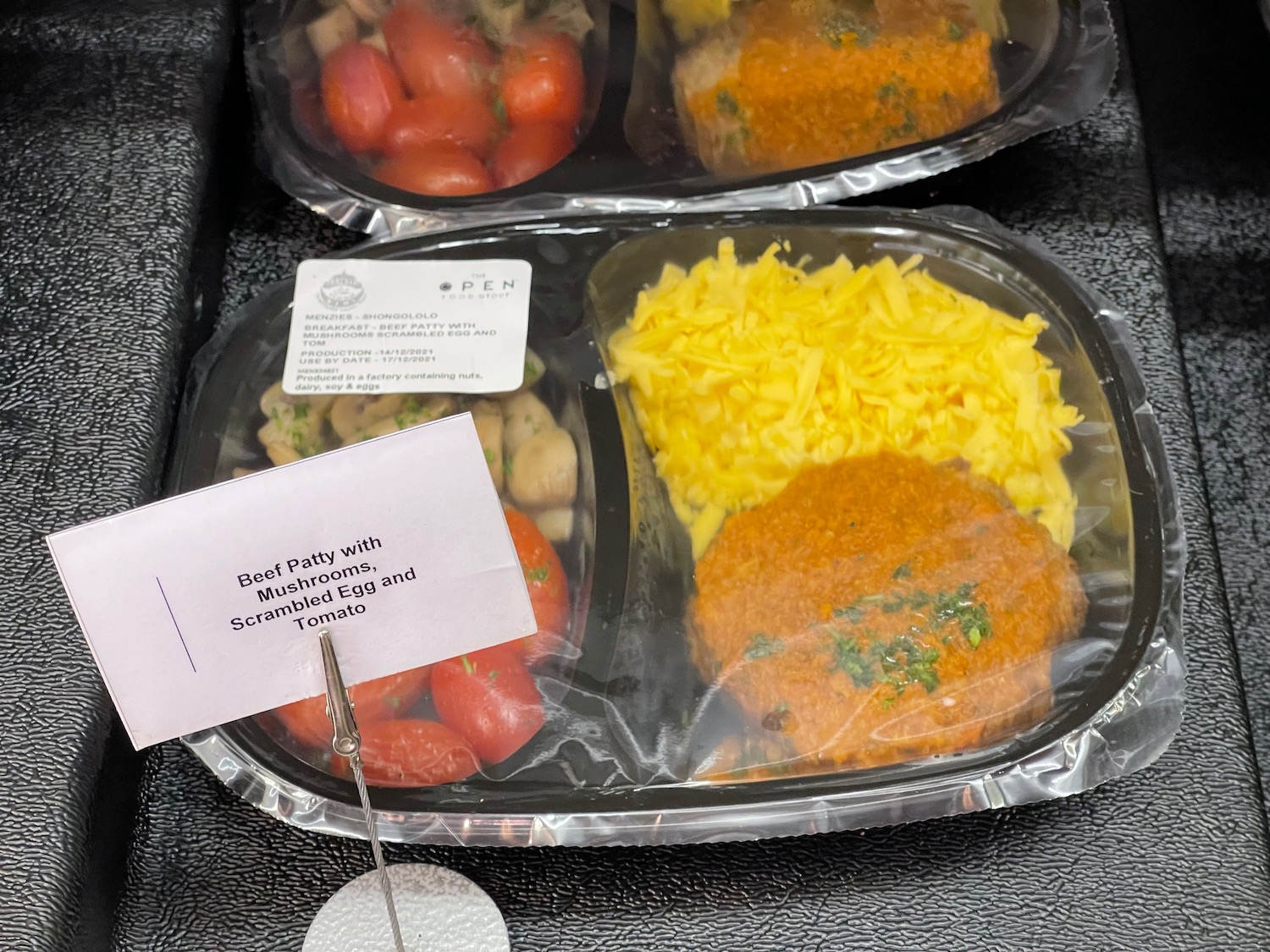 a tray of food with a note