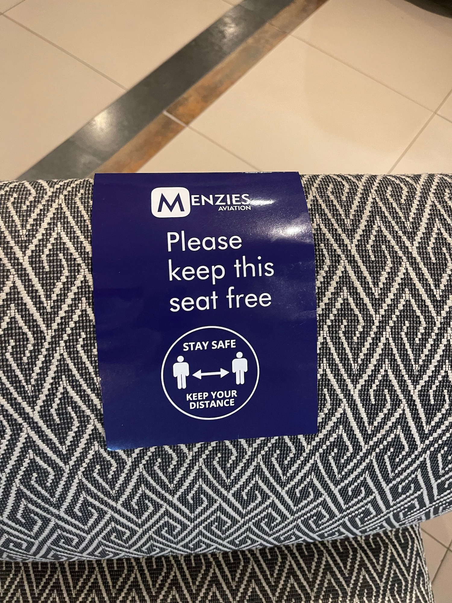 a blue sign on a seat