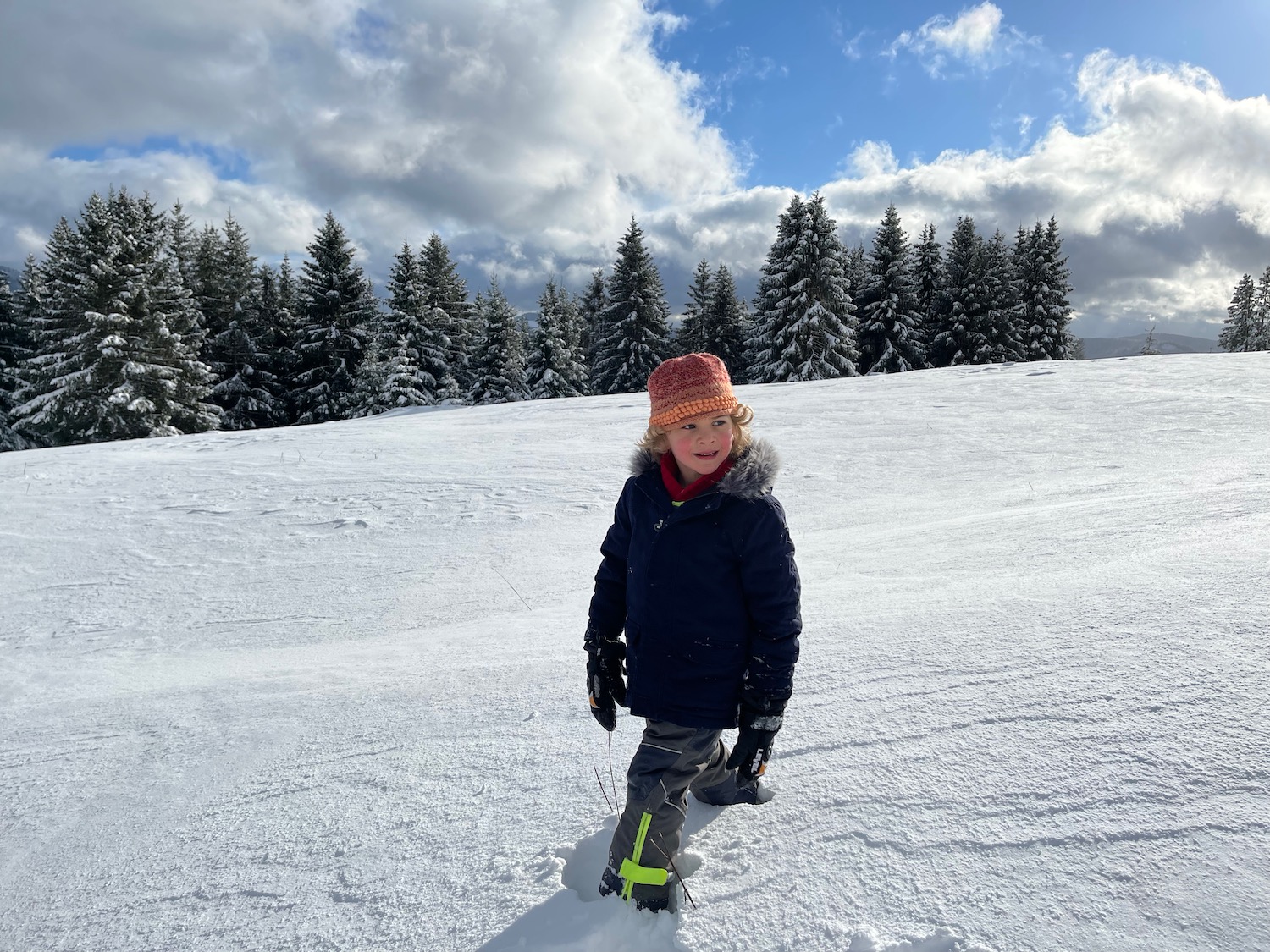 a child standing in the snow