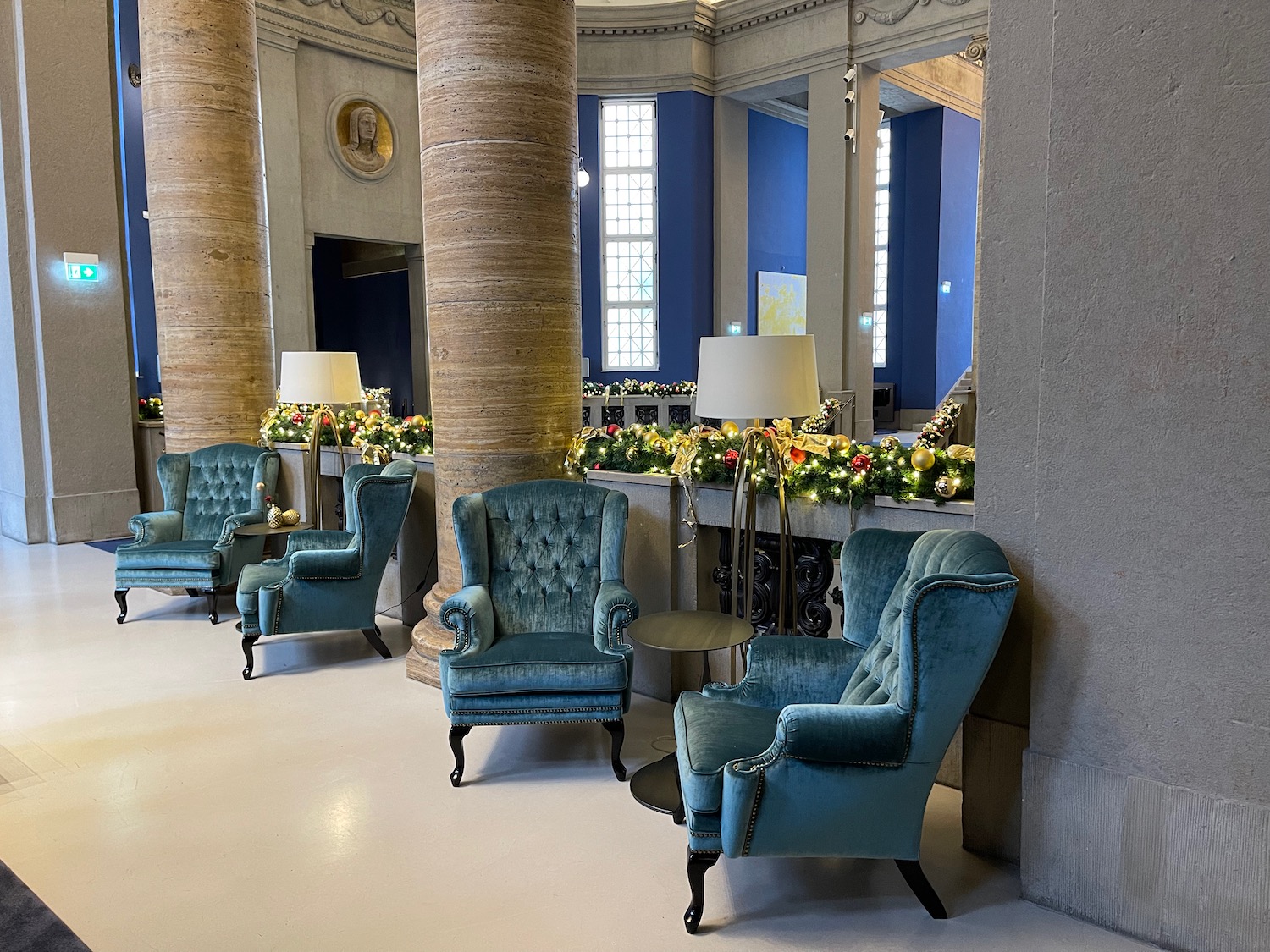 a room with blue chairs and a table