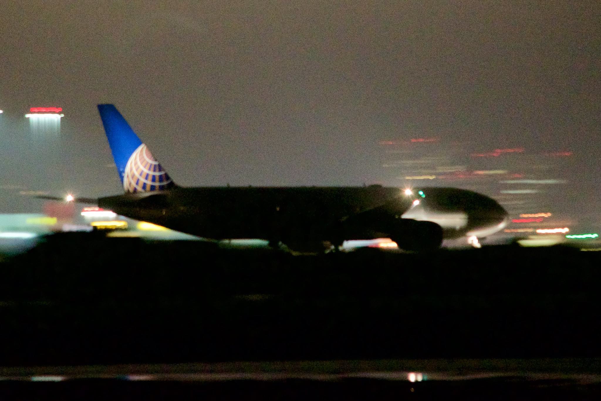 a plane on the runway at night