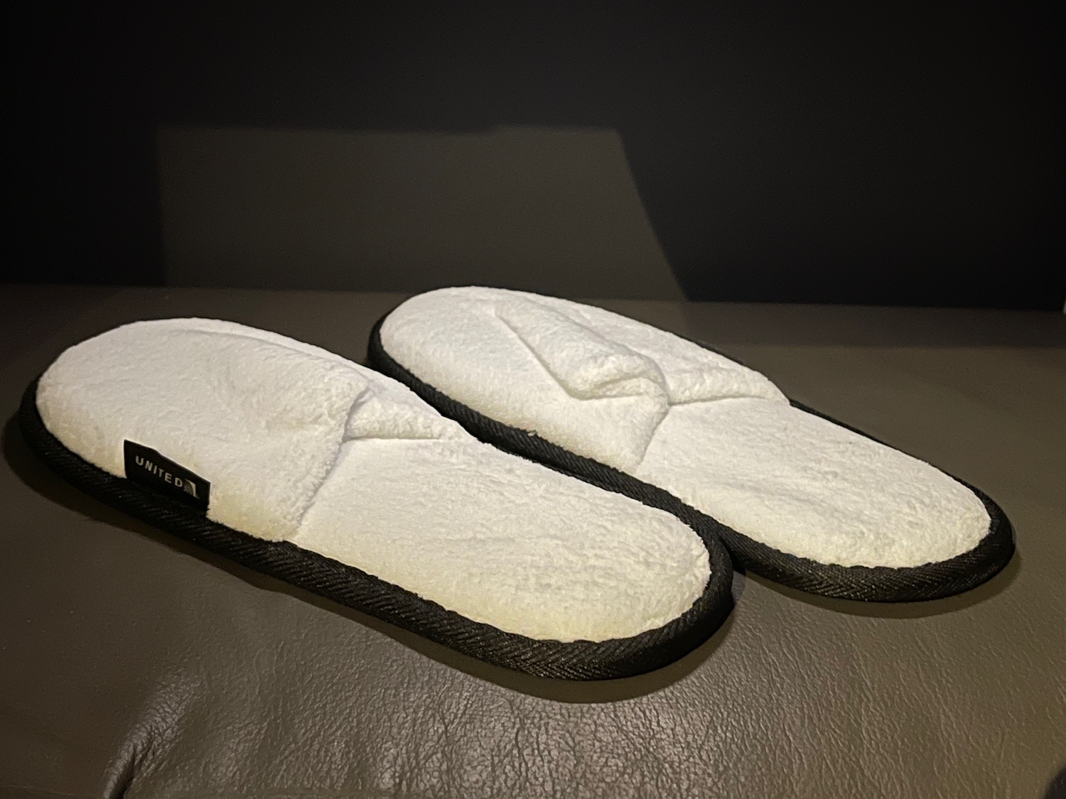 a pair of white slippers