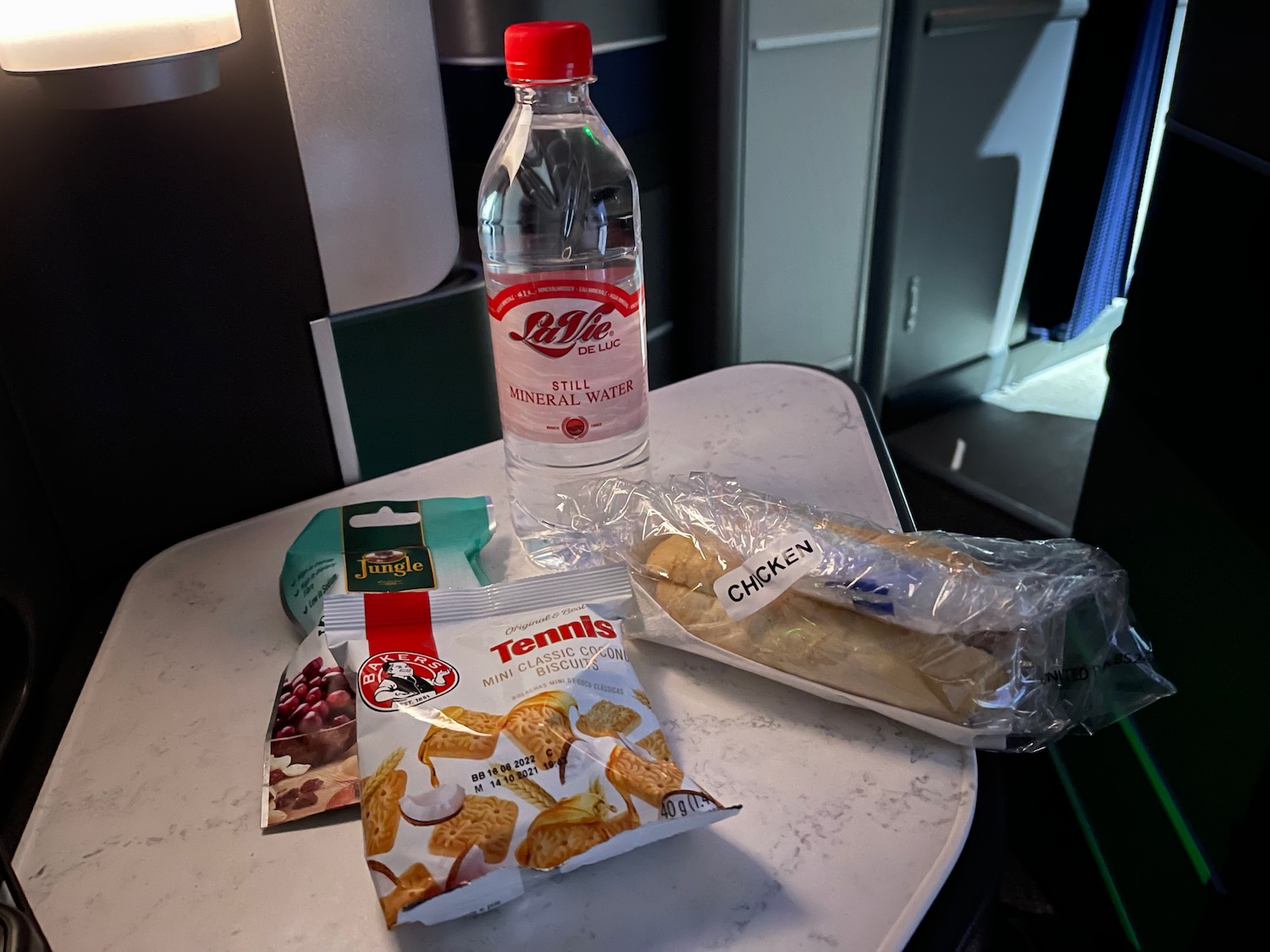 a bottle of water and food on a table