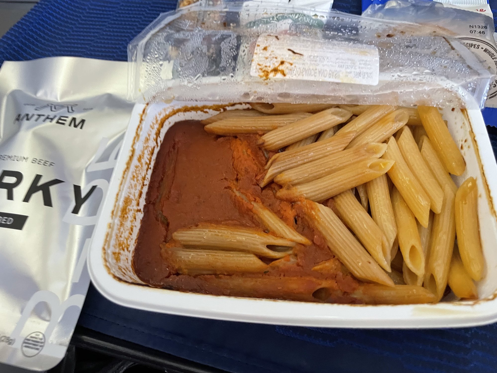 a container of pasta and sauce