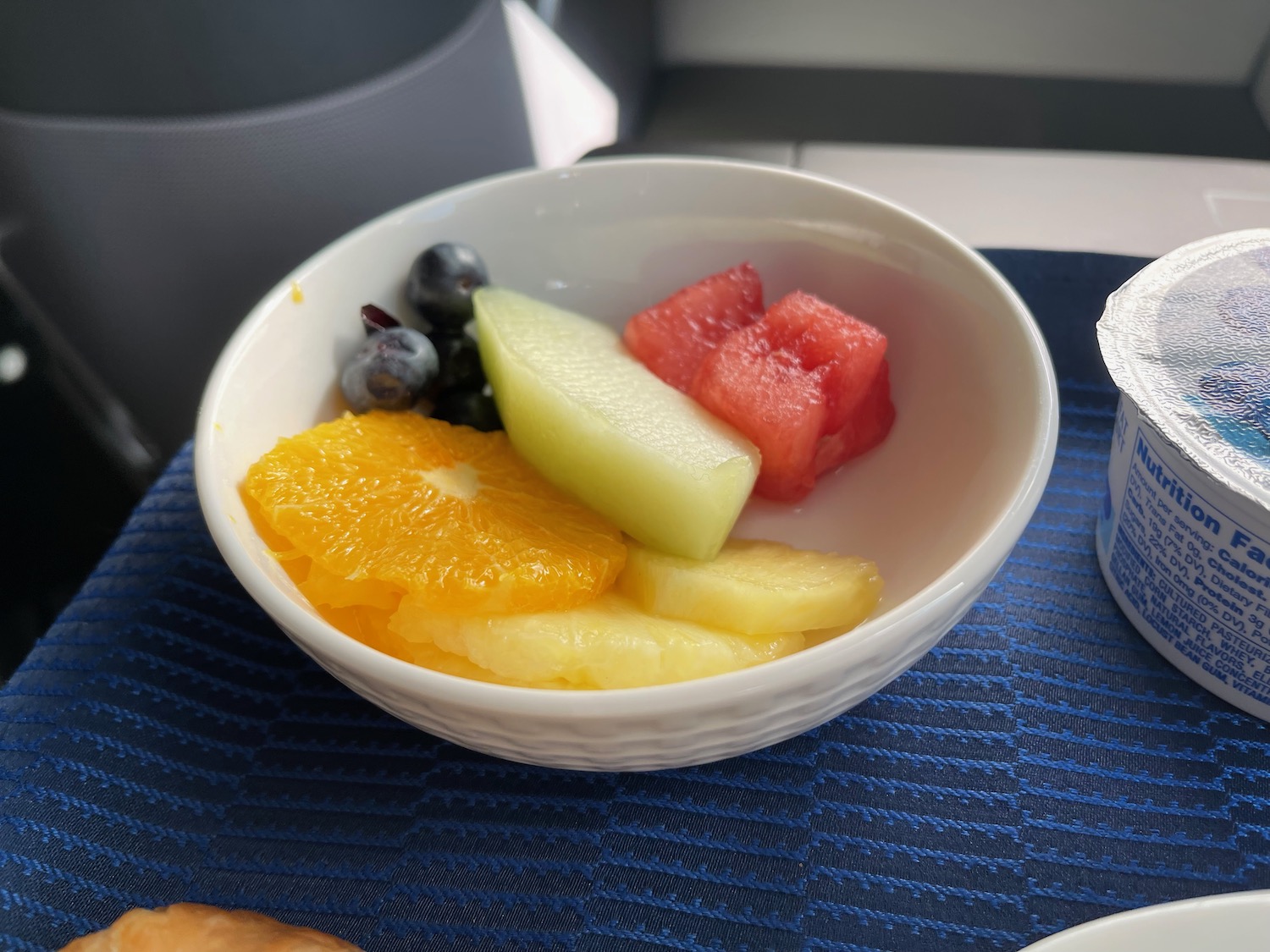 a bowl of fruit on a table