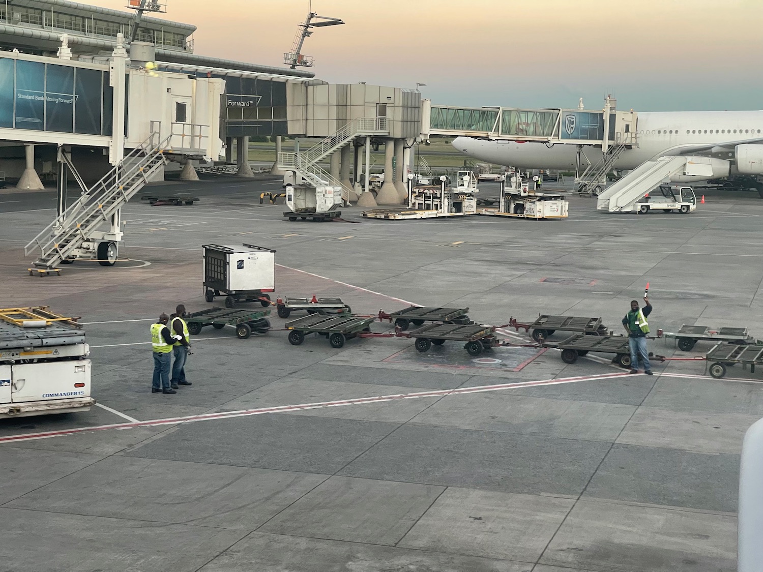 a group of people standing near a plane