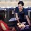 a woman serving food to another woman