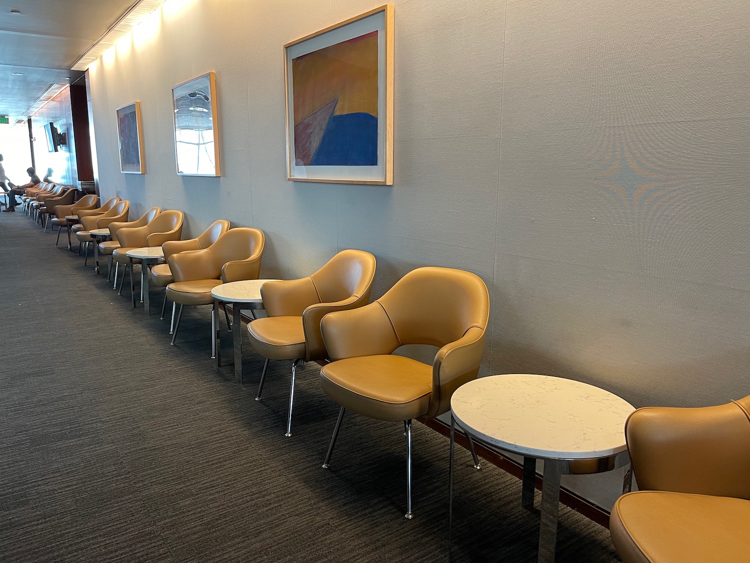 a row of chairs and tables in a room