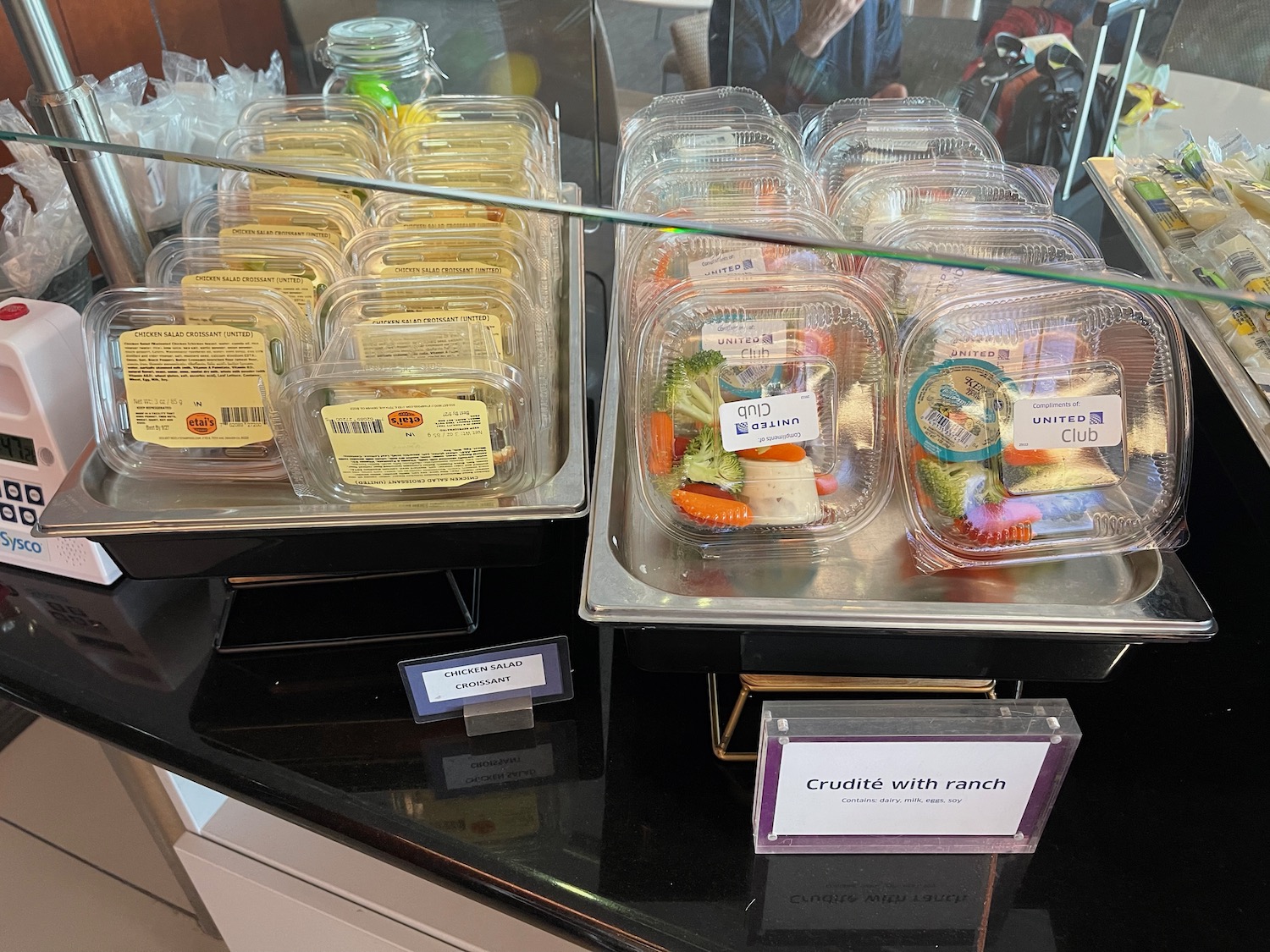plastic containers of food on a counter