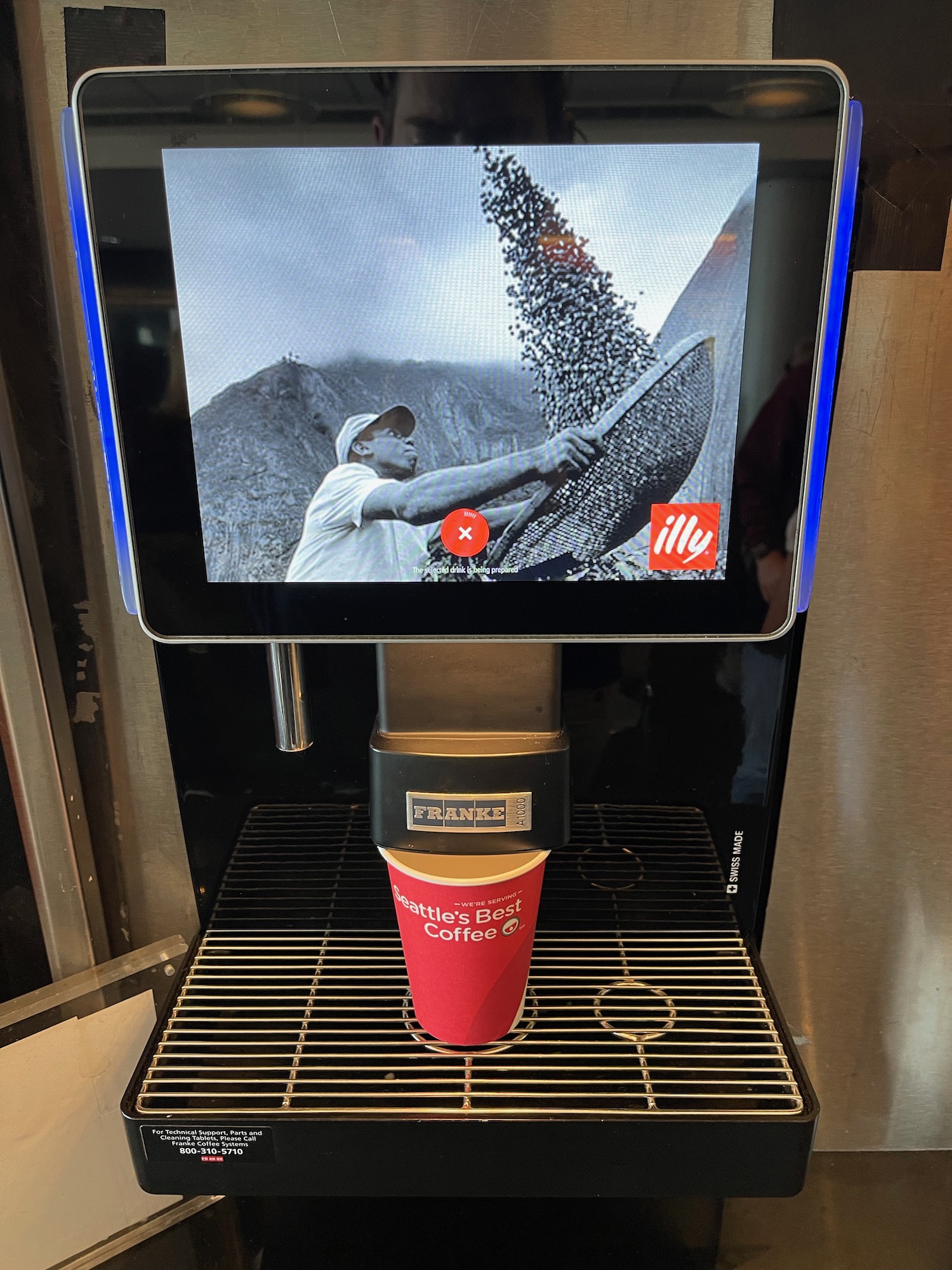 a coffee machine with a screen on it