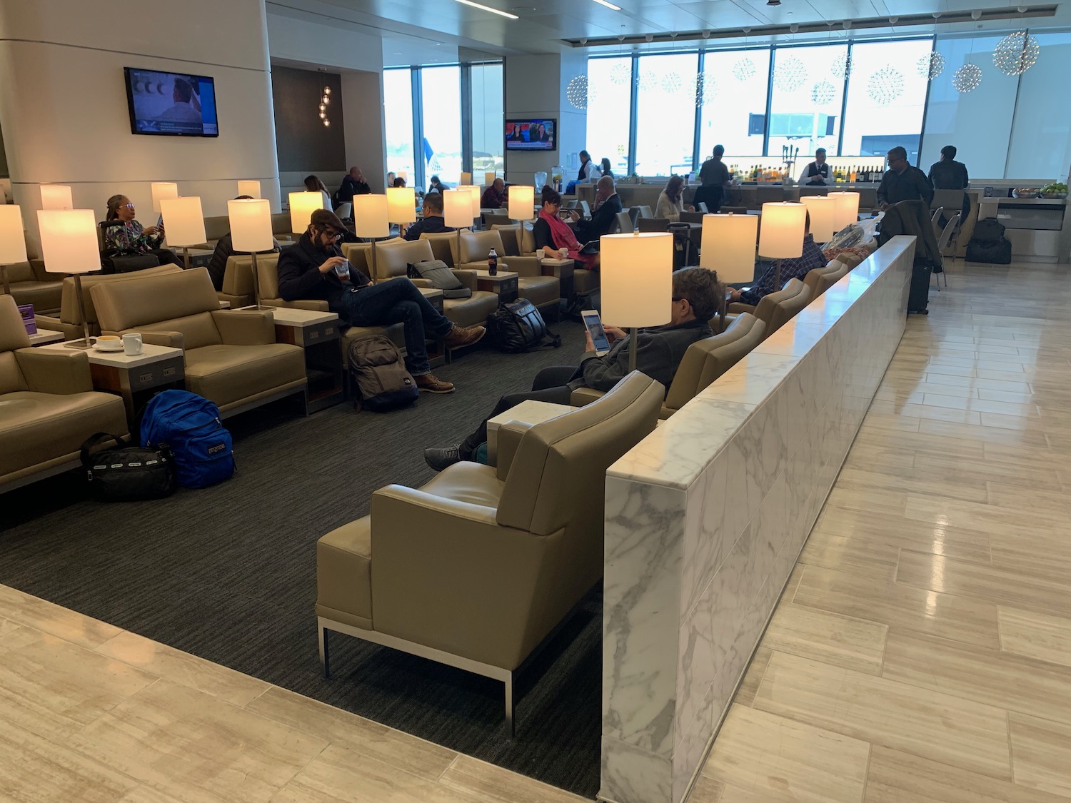 a group of people sitting in a lounge