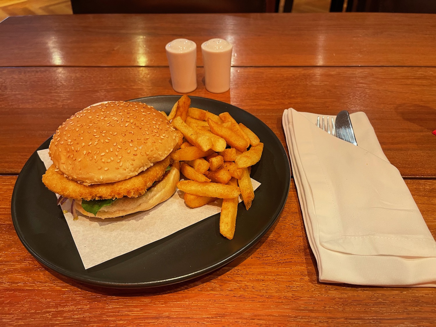 a burger and fries on a plate