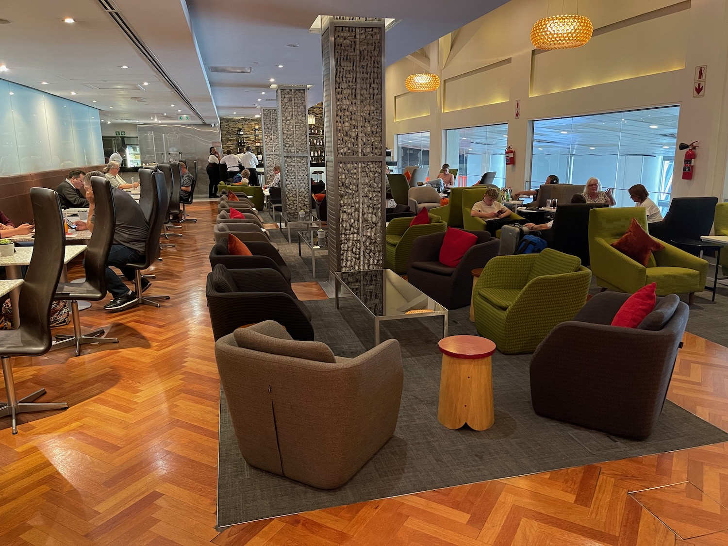 a group of people sitting in a room with chairs