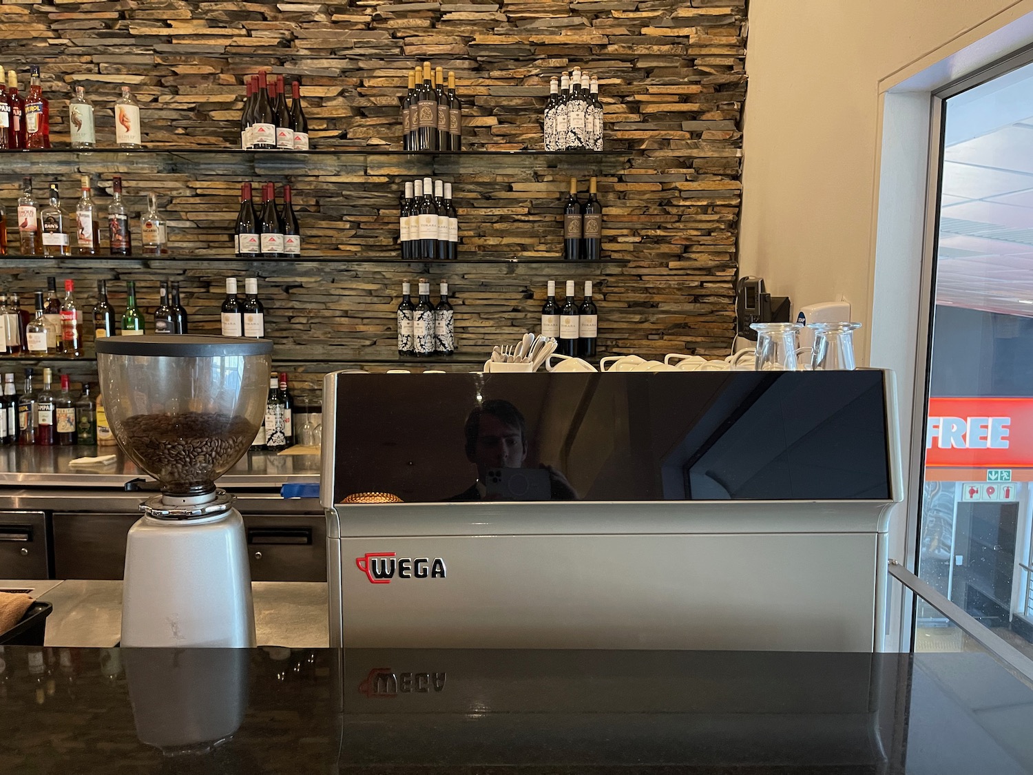 a counter with a blender and a coffee grinder