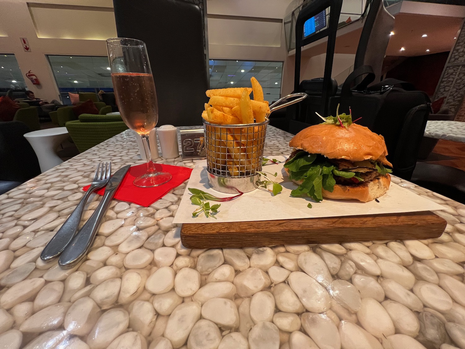 a burger and fries on a table