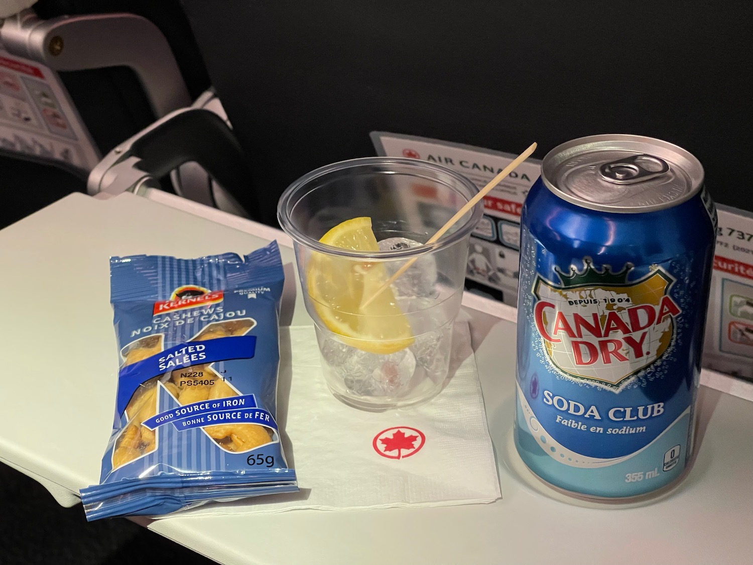 a drink and a can of soda on a table