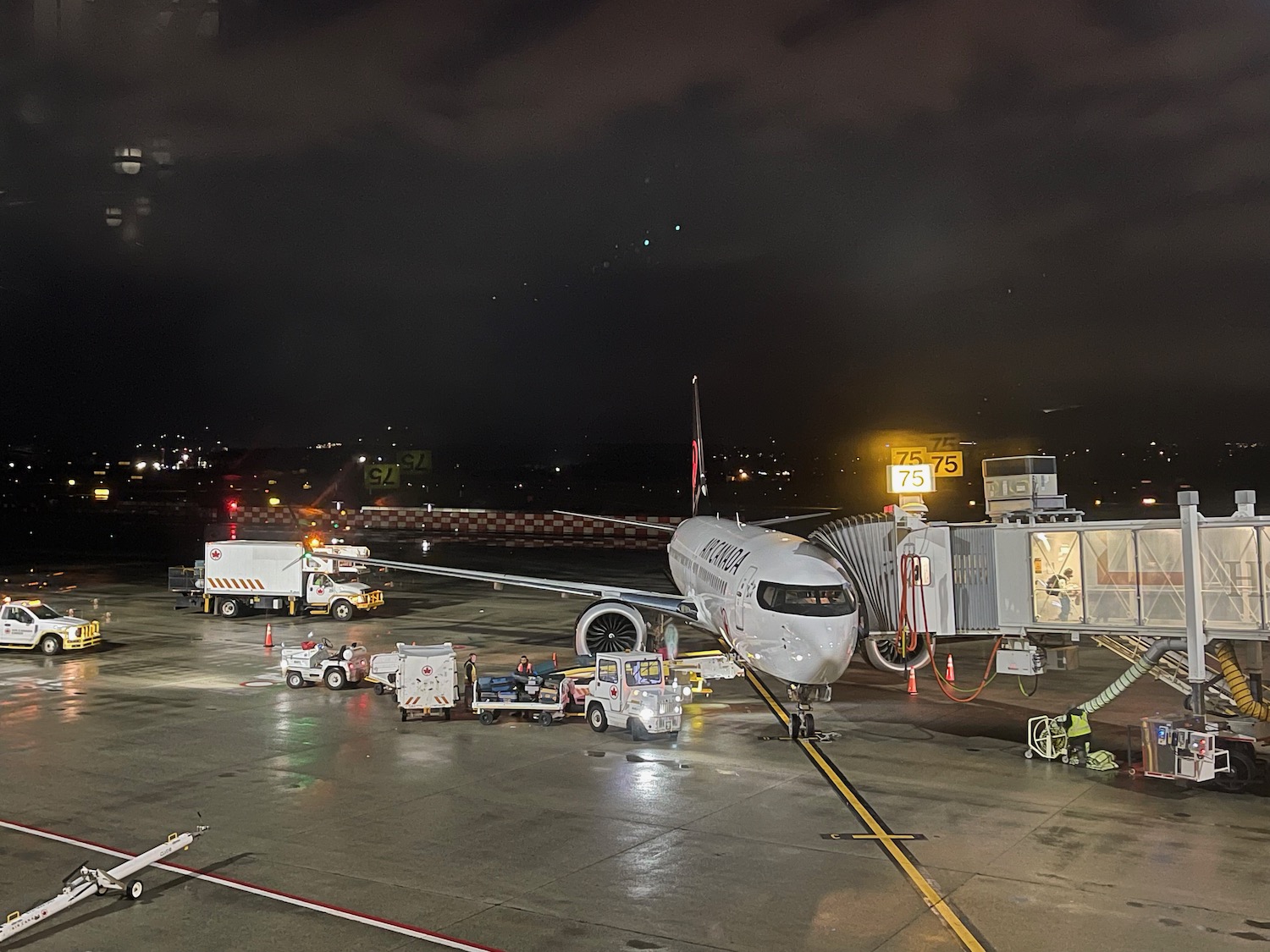 an airplane on the tarmac at night