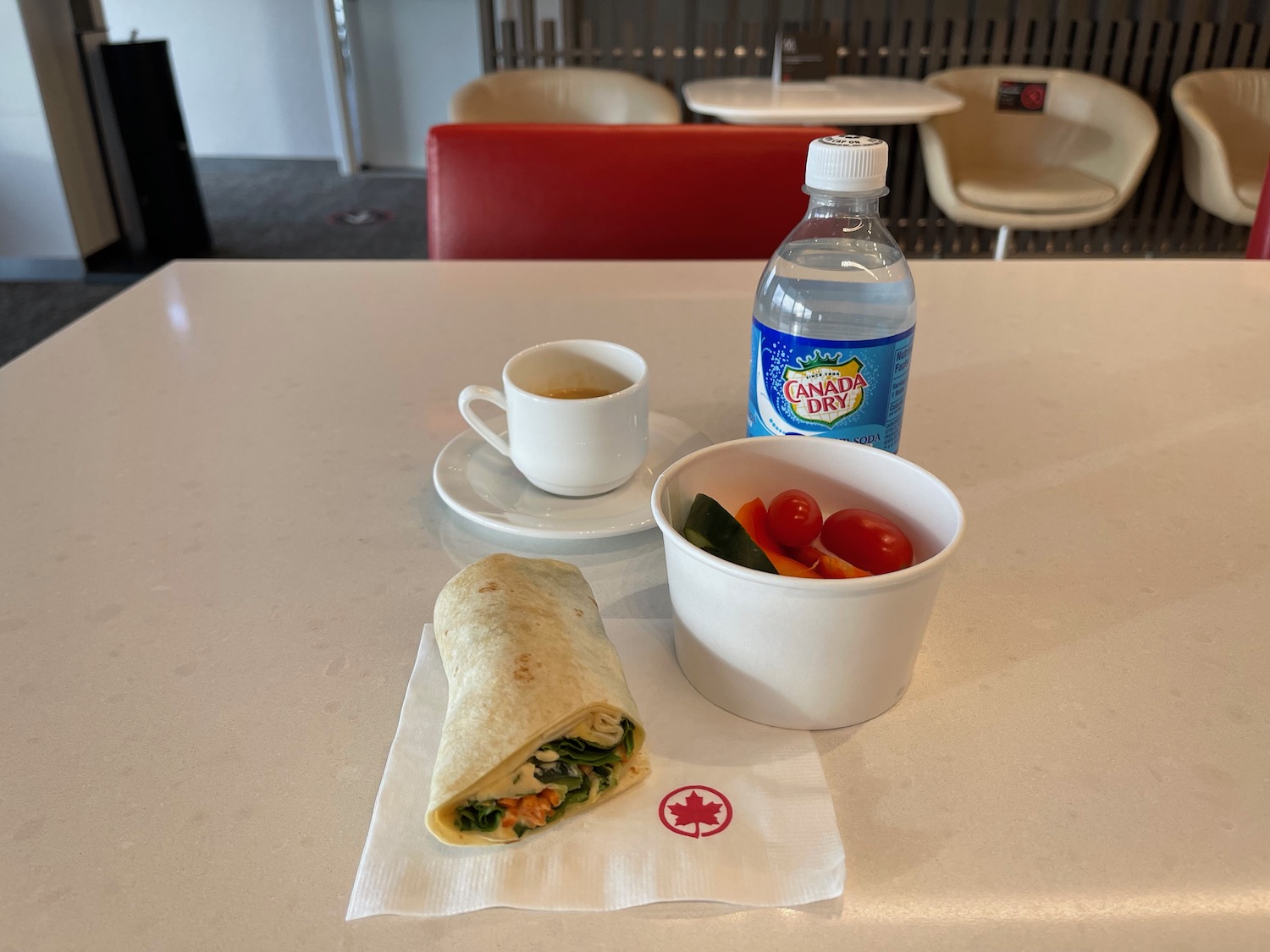 a burrito and a cup of coffee on a table