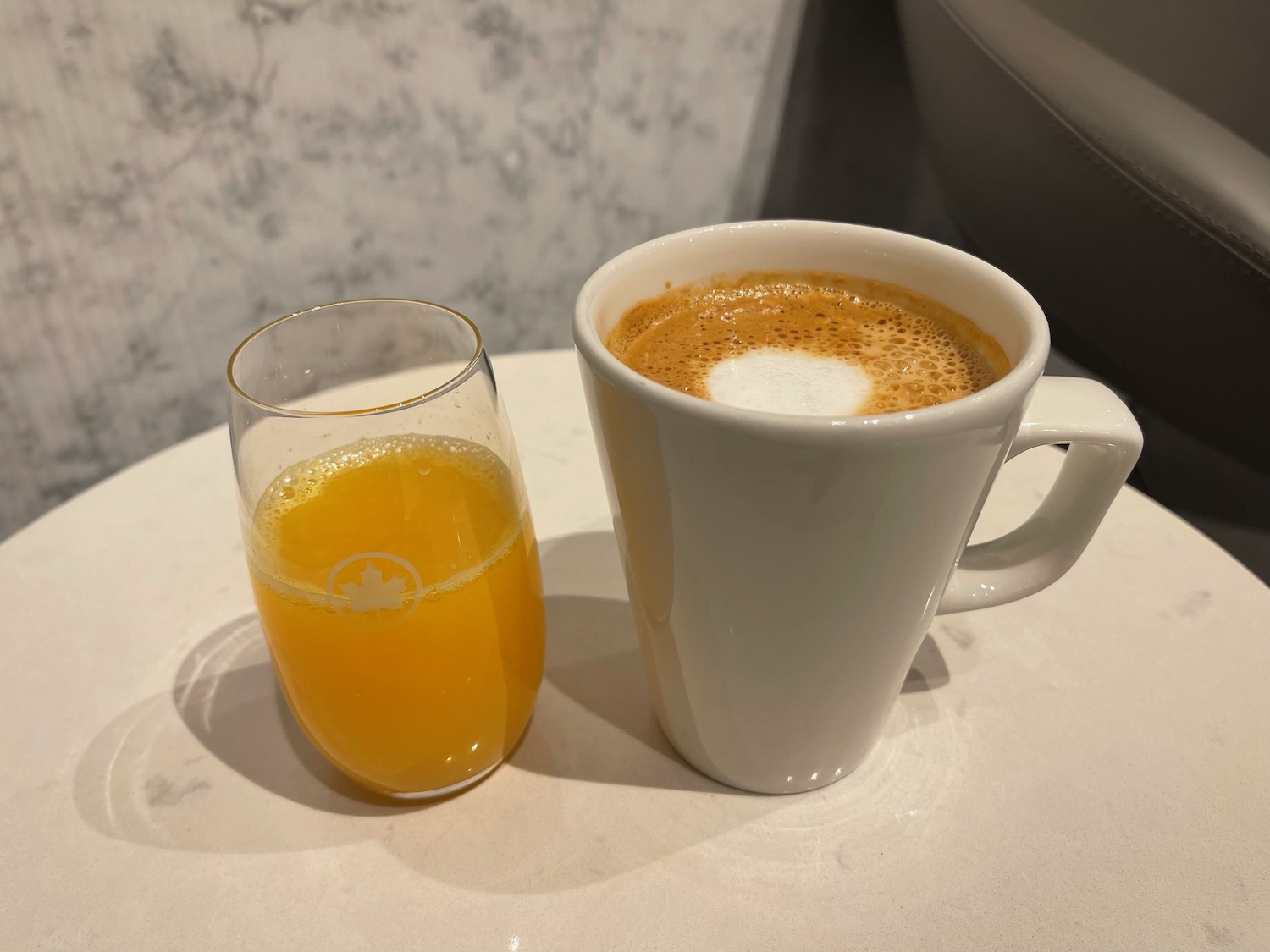 a cup of coffee and a glass of orange juice
