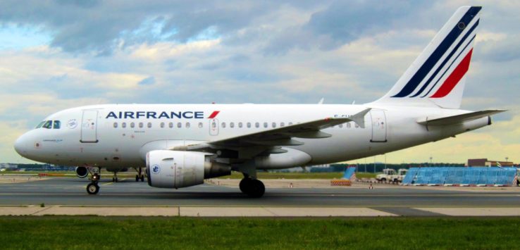 a white airplane on a runway