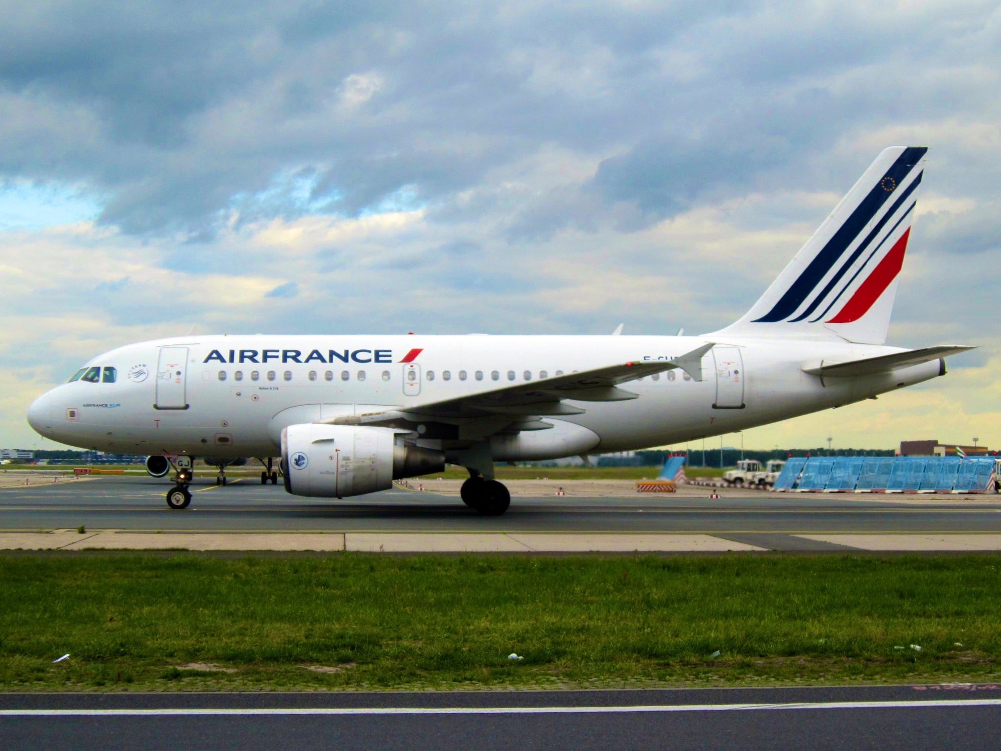 a white airplane on a runway