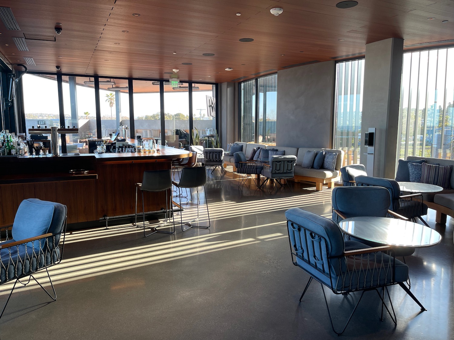 a room with a bar and chairs