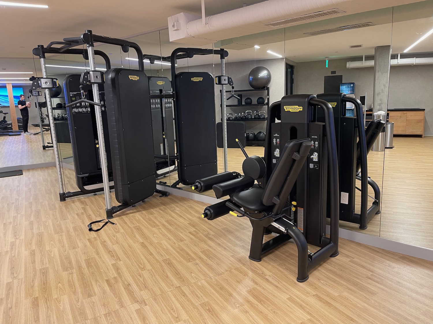 a gym with several exercise equipment