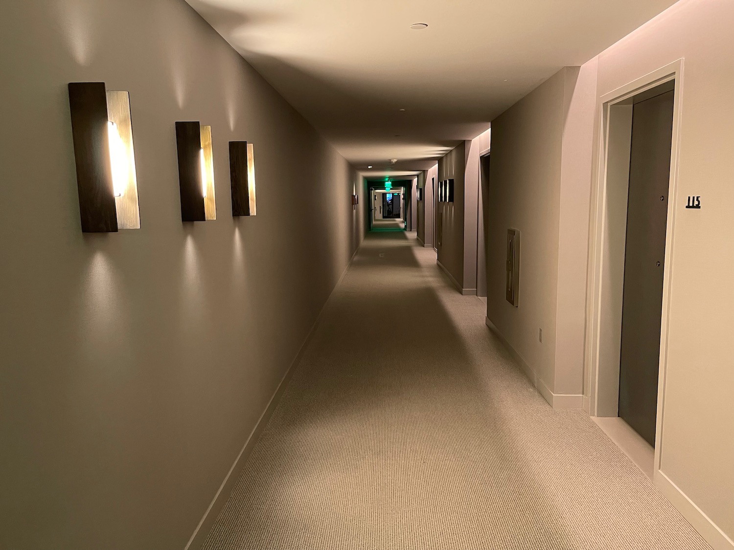 a hallway with lights on the wall