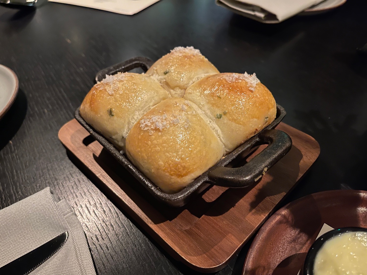 a tray of bread on a wood surface