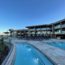 a pool and a building with a pool in the background