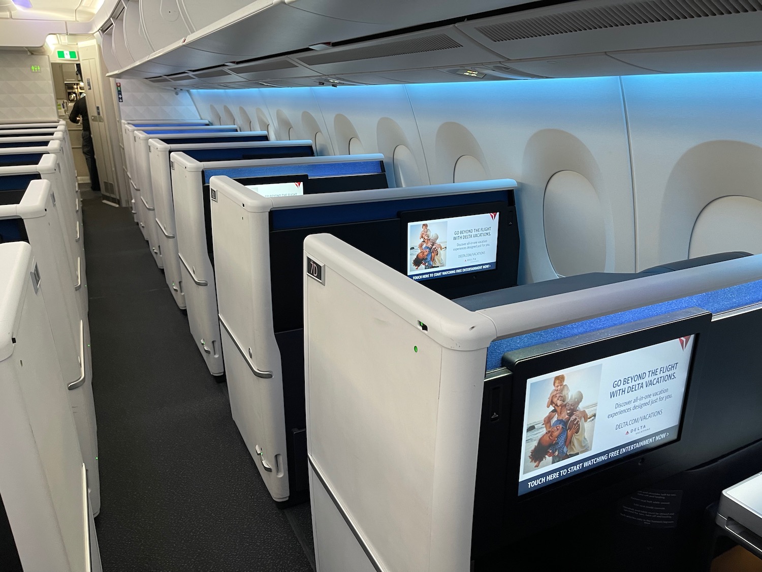 a row of tvs on an airplane