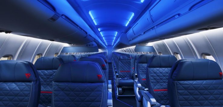 the inside of an airplane with blue lights