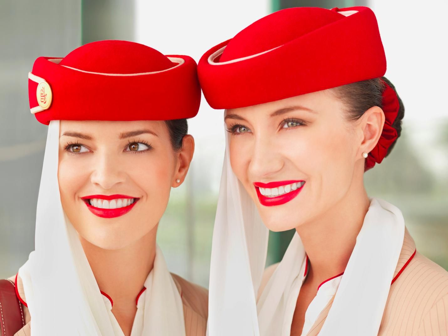 a couple of women wearing red hats