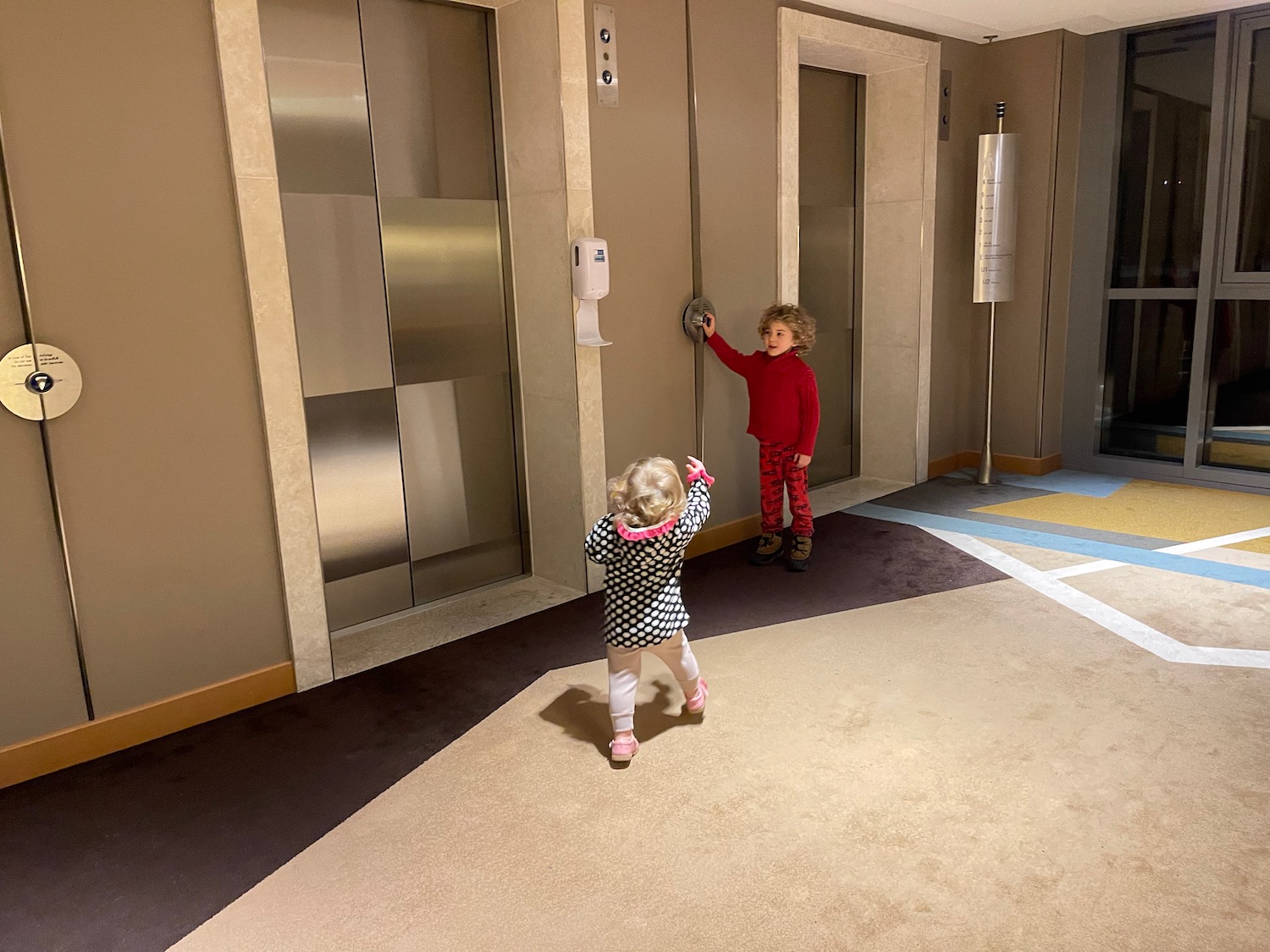 a two children in a hallway
