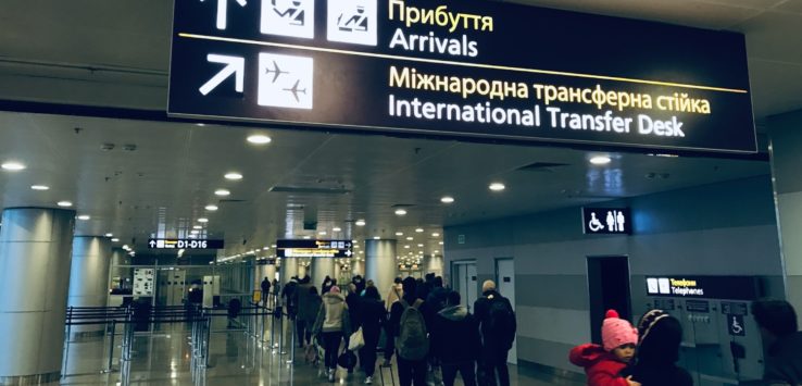 a group of people walking in an airport