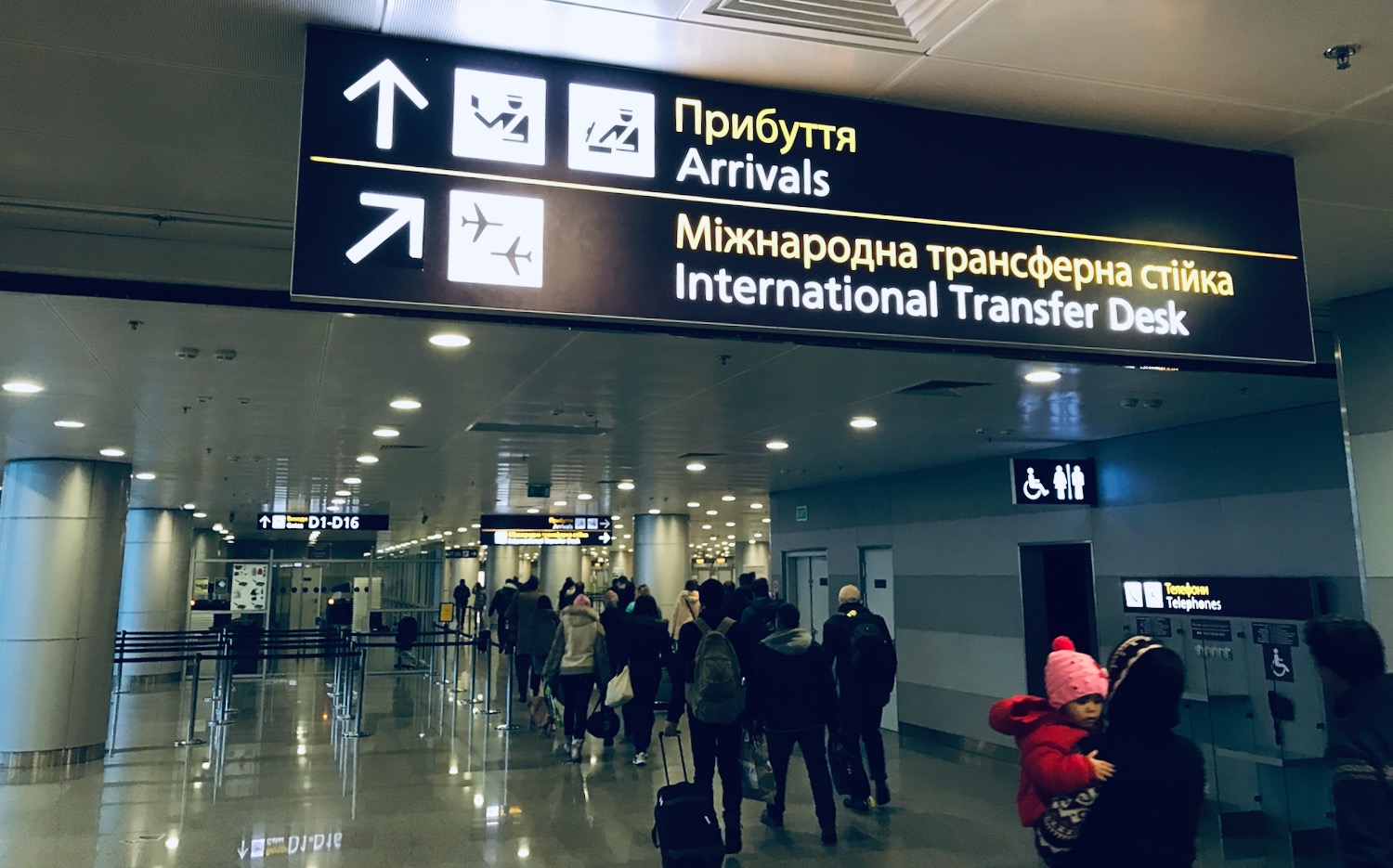 a group of people walking in an airport