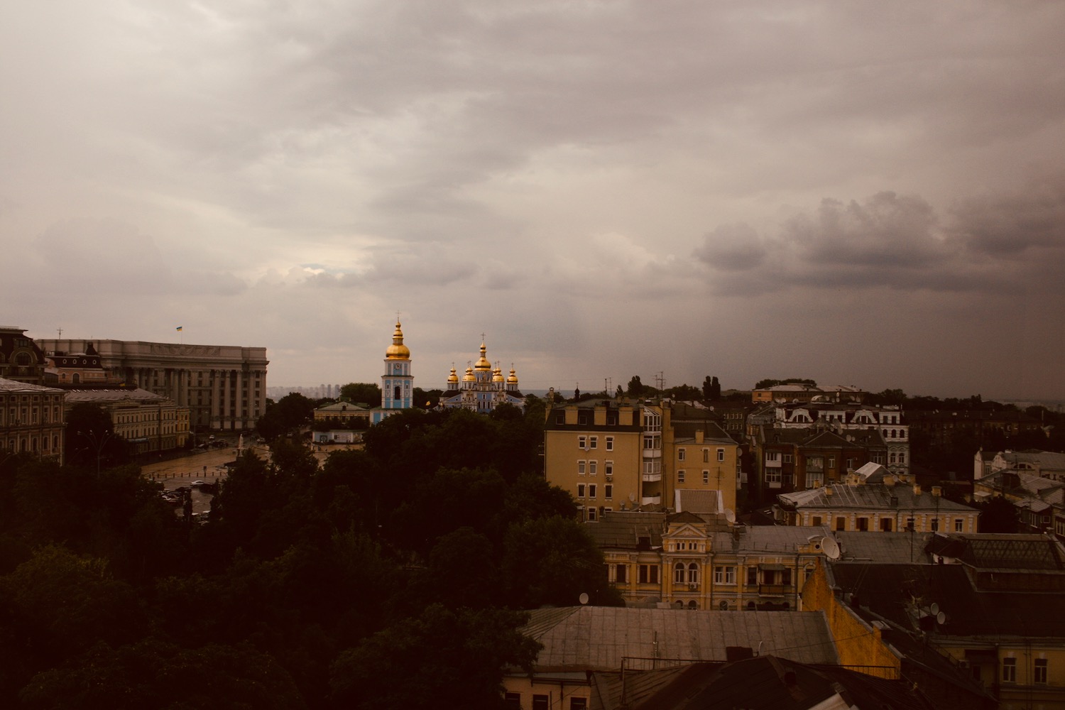 a city with many buildings and trees