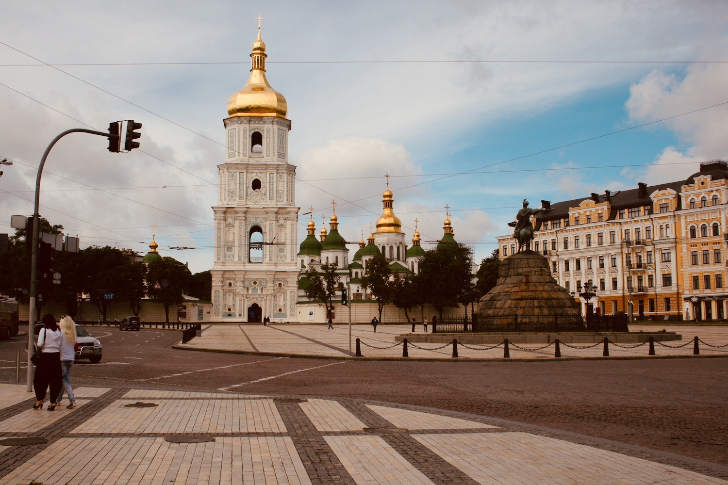a large white building with gold domes