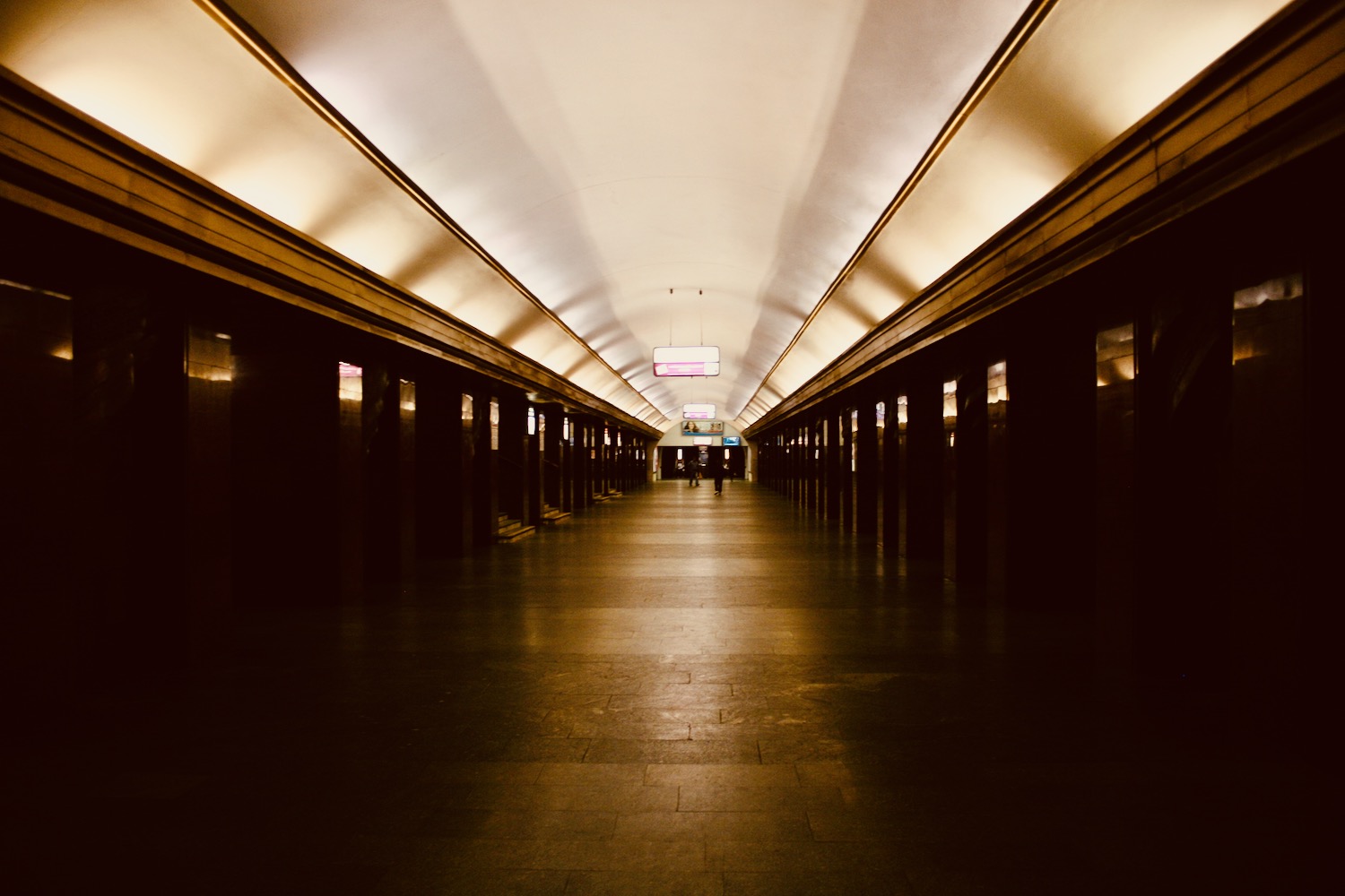 a long hallway with a light on the ceiling