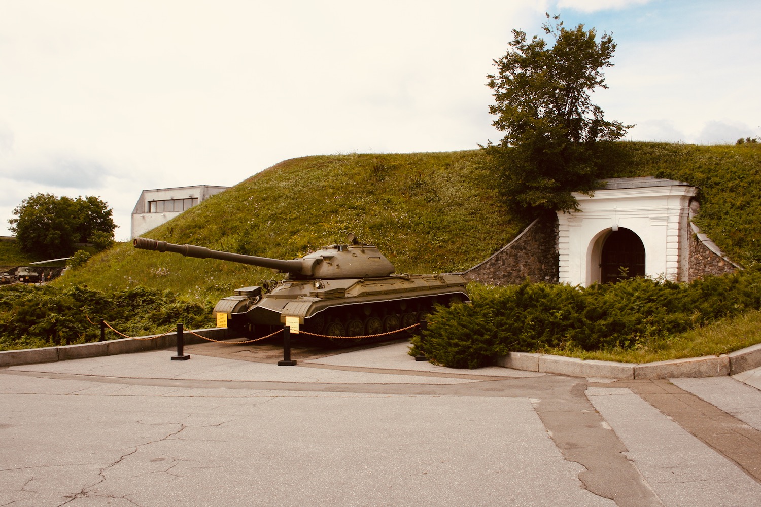 a tank on display in front of a building