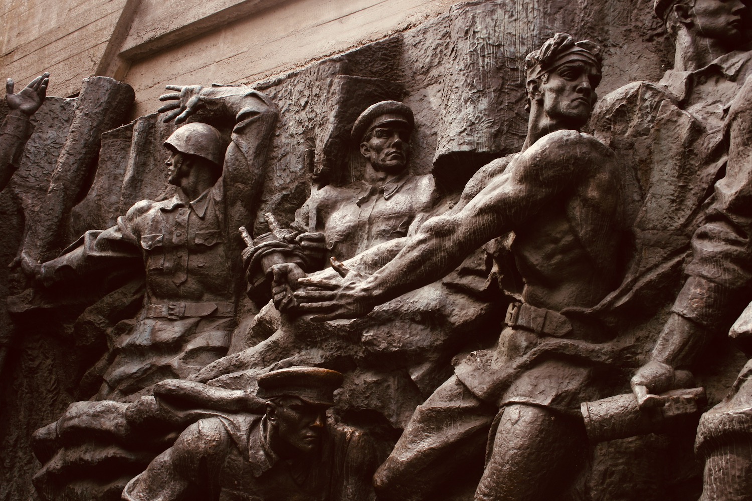 a statue of men in military uniforms