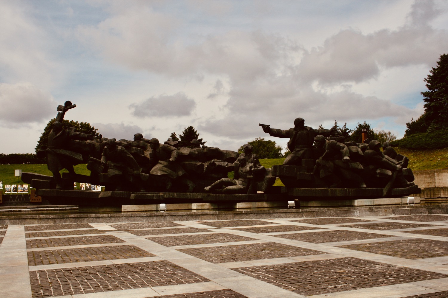 a group of statues in a plaza