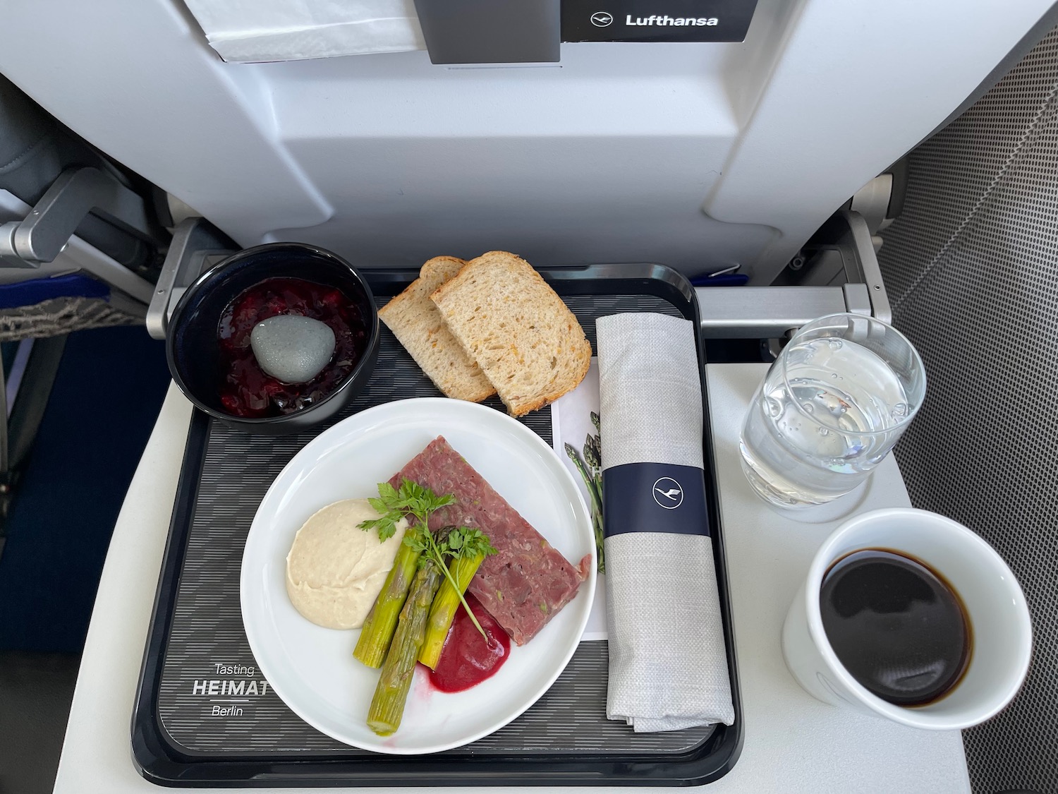 a tray with food and a cup of coffee on it