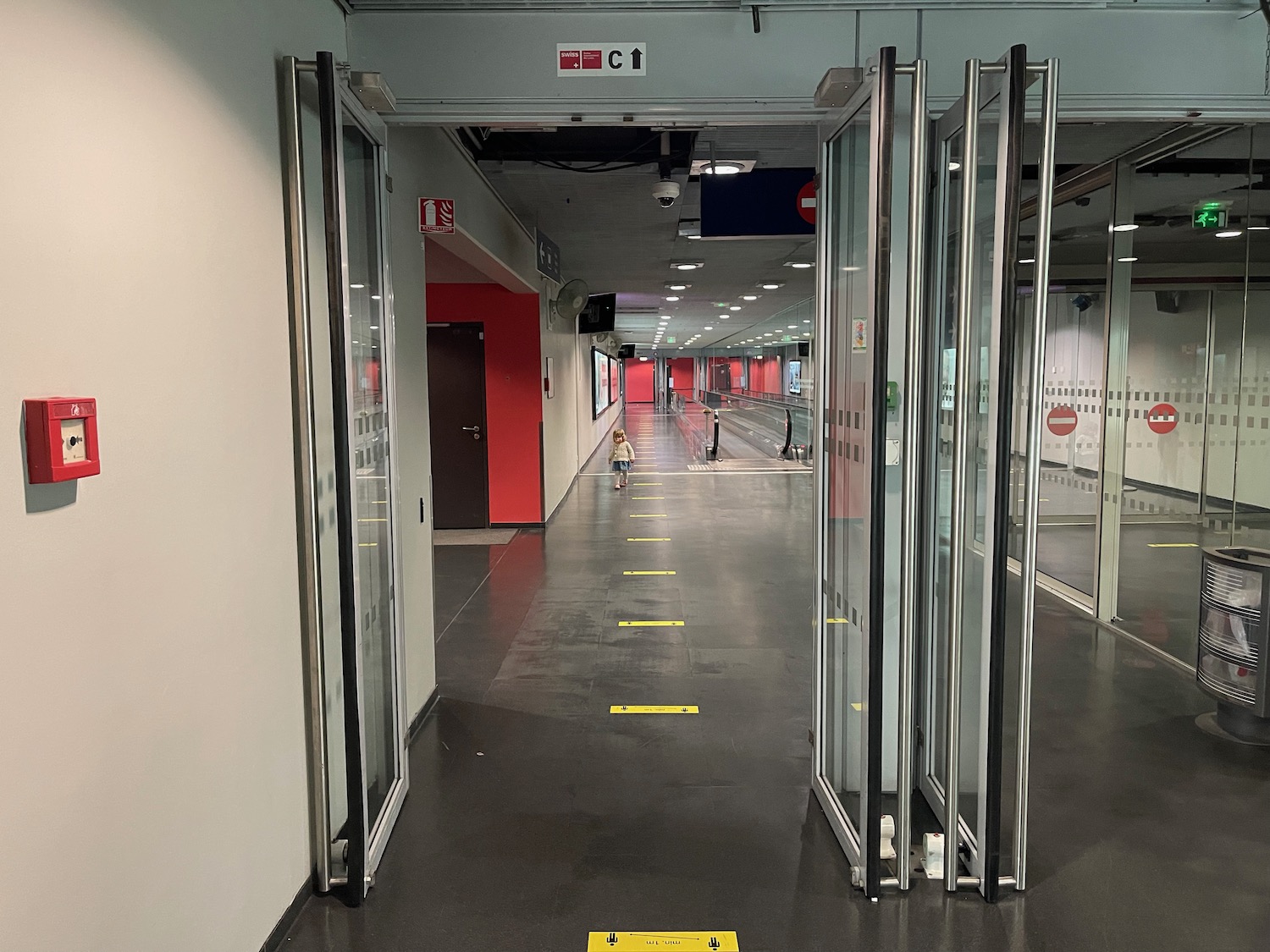 a hallway with glass doors